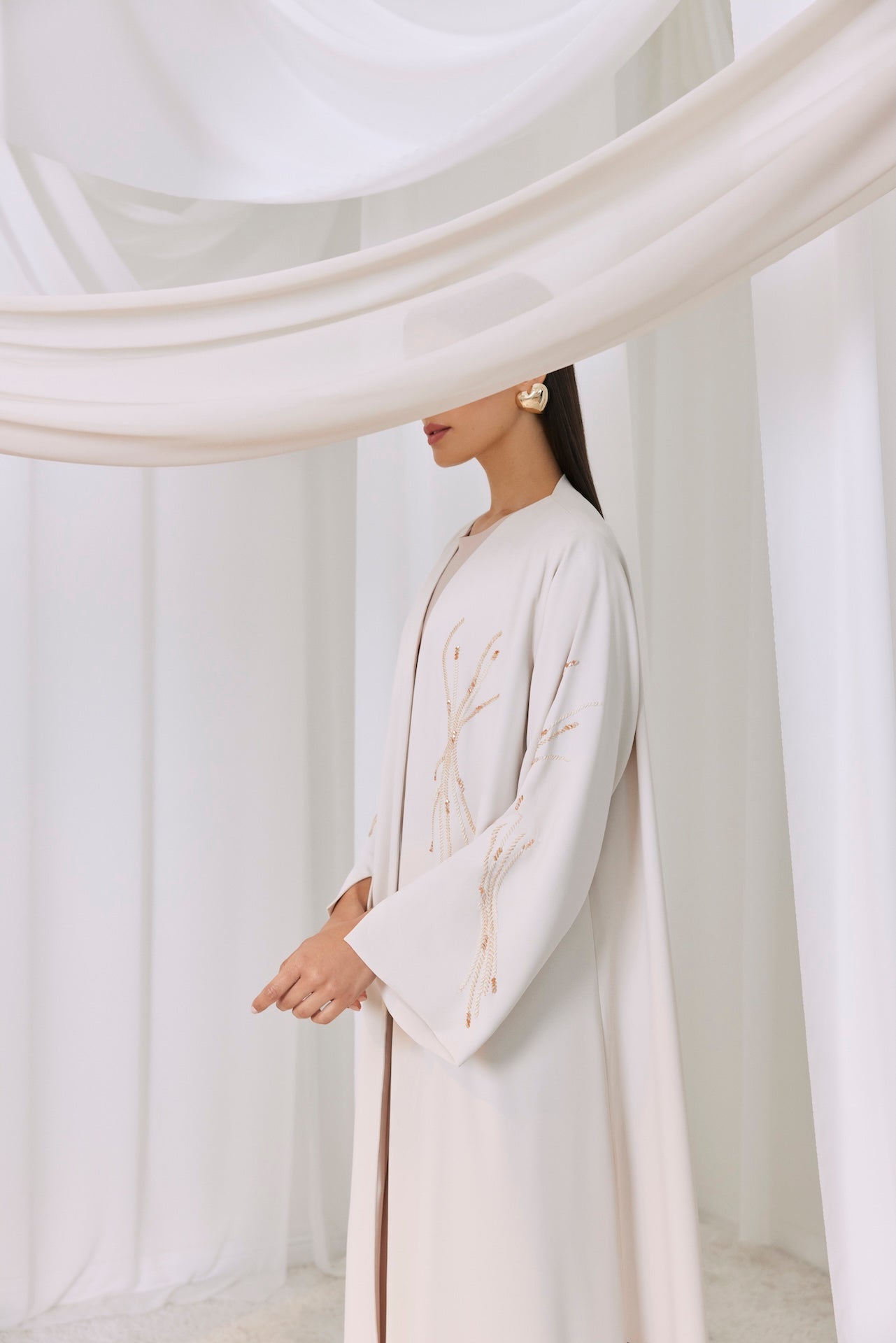 Golden Whisper - The McQueen Boutique - Abaya - Abaya Dubai - Abaya Abu Dhabi - Abaya UAE - Abaya - Elegant - Luxury - Emirati - Classic - Modern - Occasion - Traditional - Trends - Embroidery - Modes