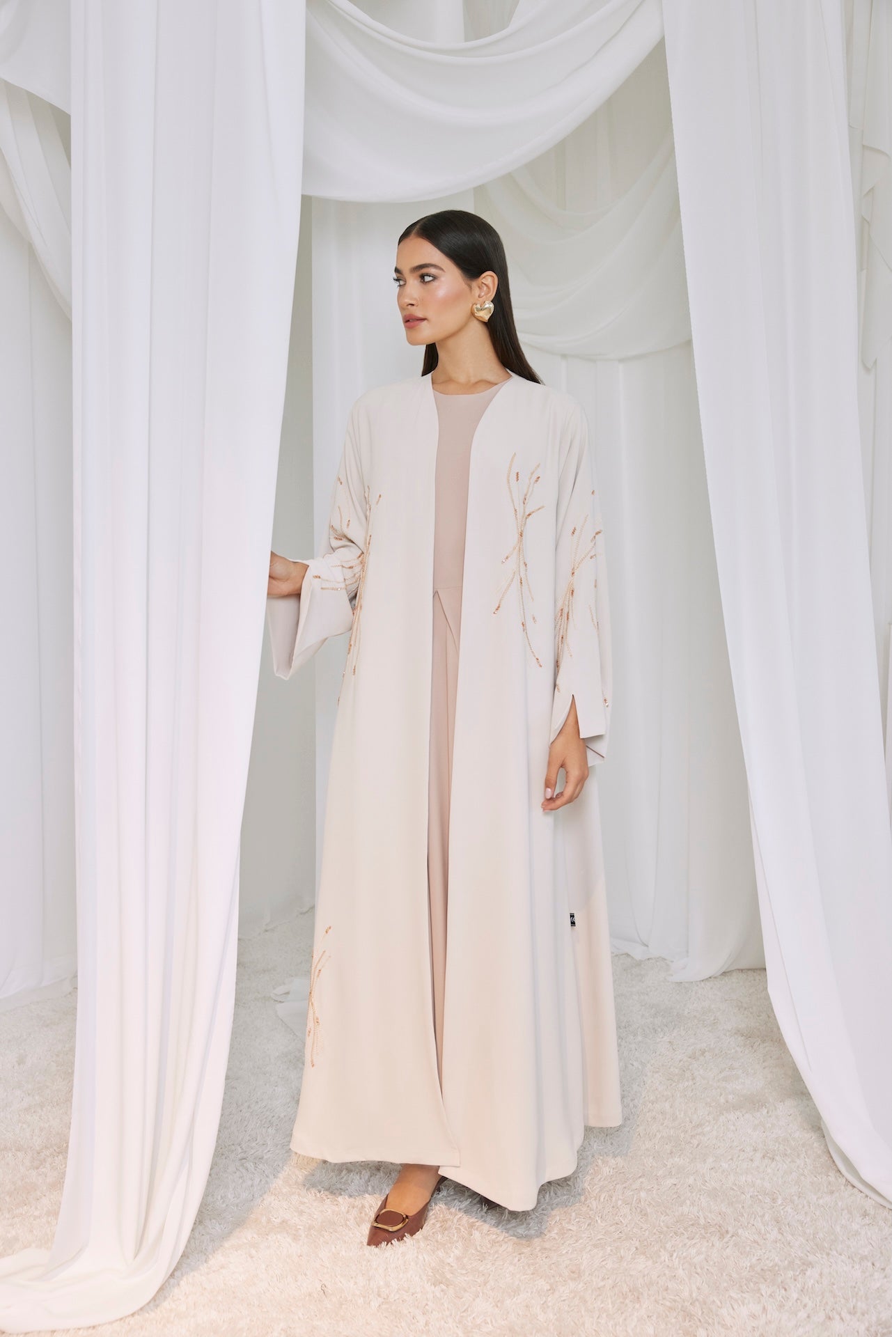Golden Whisper - The McQueen Boutique - Abaya - Abaya Dubai - Abaya Abu Dhabi - Abaya UAE - Abaya - Elegant - Luxury - Emirati - Classic - Modern - Occasion - Traditional - Trends - Embroidery - Modes