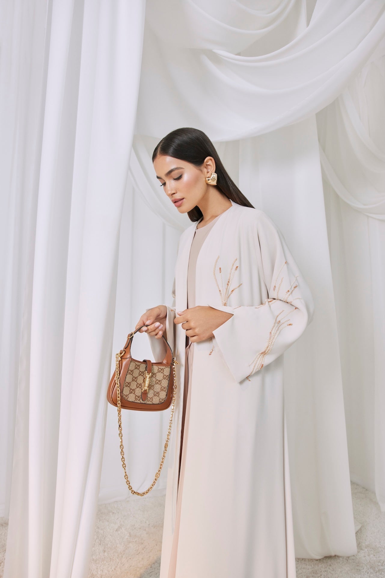 Golden Whisper - The McQueen Boutique - Abaya - Abaya Dubai - Abaya Abu Dhabi - Abaya UAE - Abaya - Elegant - Luxury - Emirati - Classic - Modern - Occasion - Traditional - Trends - Embroidery - Modes